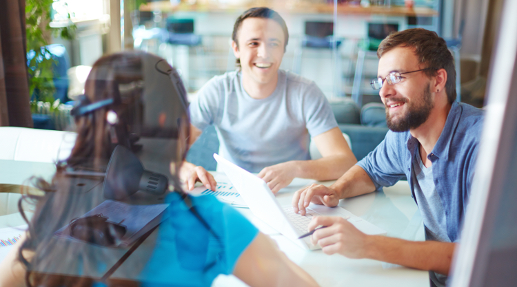 Group of co-workers collaborating at the office in a meeting
