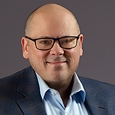 Professional headshot of Eric Mischel