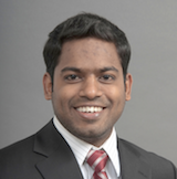 Professional headshot of Ash Vemulapalli