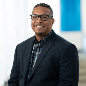 Professional headshot of Joe Lige