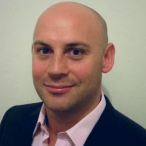 Professional headshot of Paul Woodrow