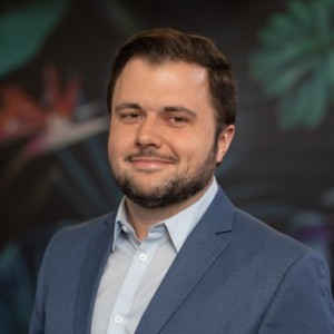 Professional headshot of Adam Smith