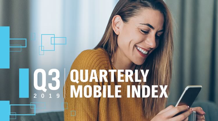 A smiling woman looking at her cell phone with the text 