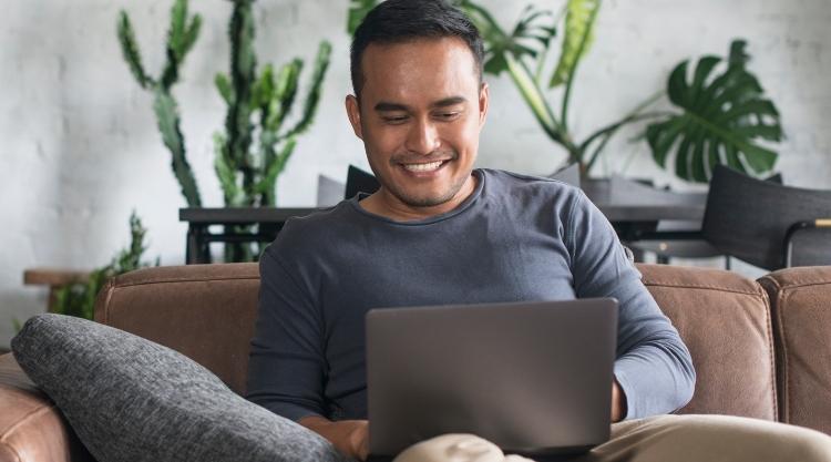 Young Asian man working at home
