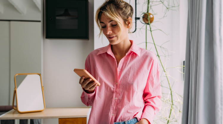 A woman is working on her phone