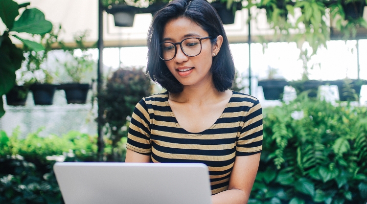 Woman reading on laptop