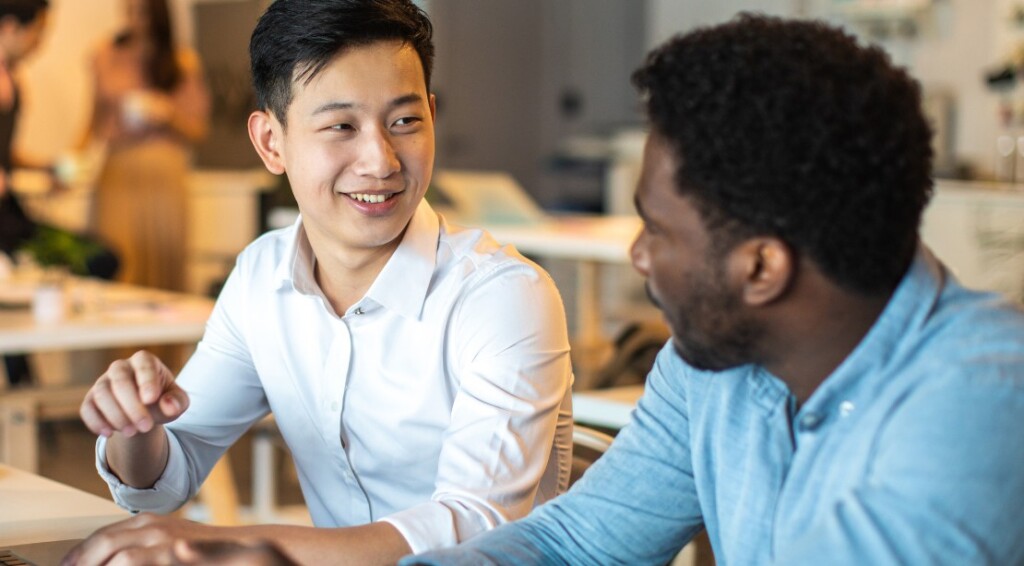 Multi-ethnic businessmen discussion about project in office
