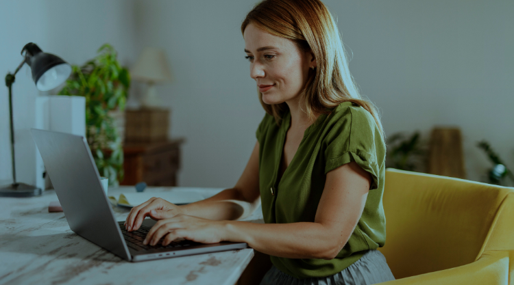 Woman working at home smiling